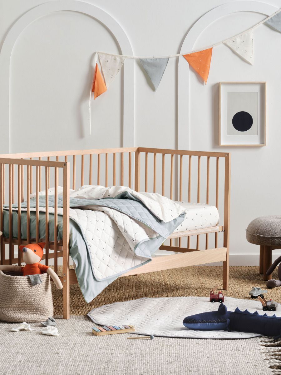 Smiles All Round Sugar-Smoke Cot Coverlet